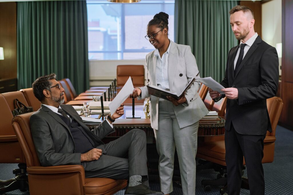 secretary-passing-document-to-boss-2025-03-16-13-41-30-utc-min