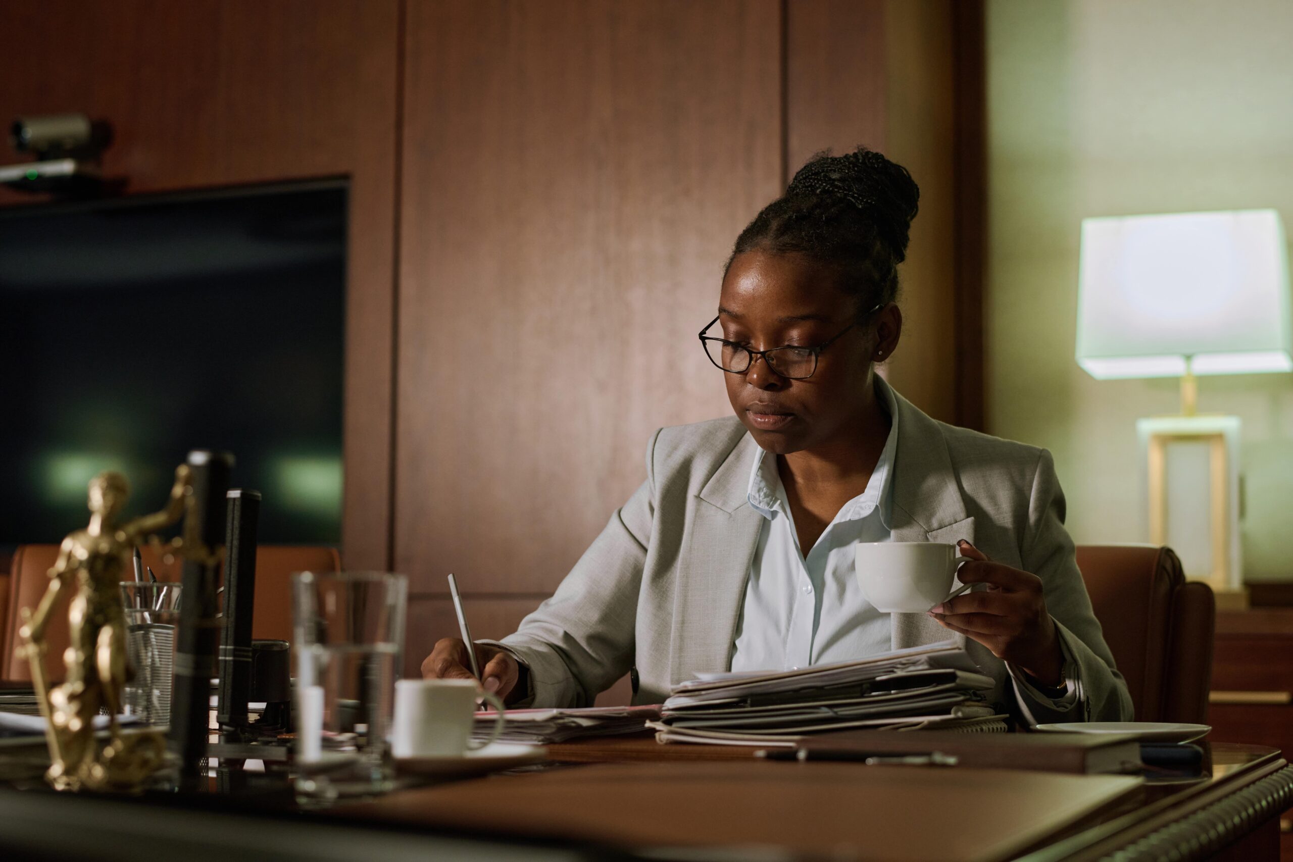 young-female-notary-with-cup-of-coffee-2025-03-15-23-03-04-utc-min