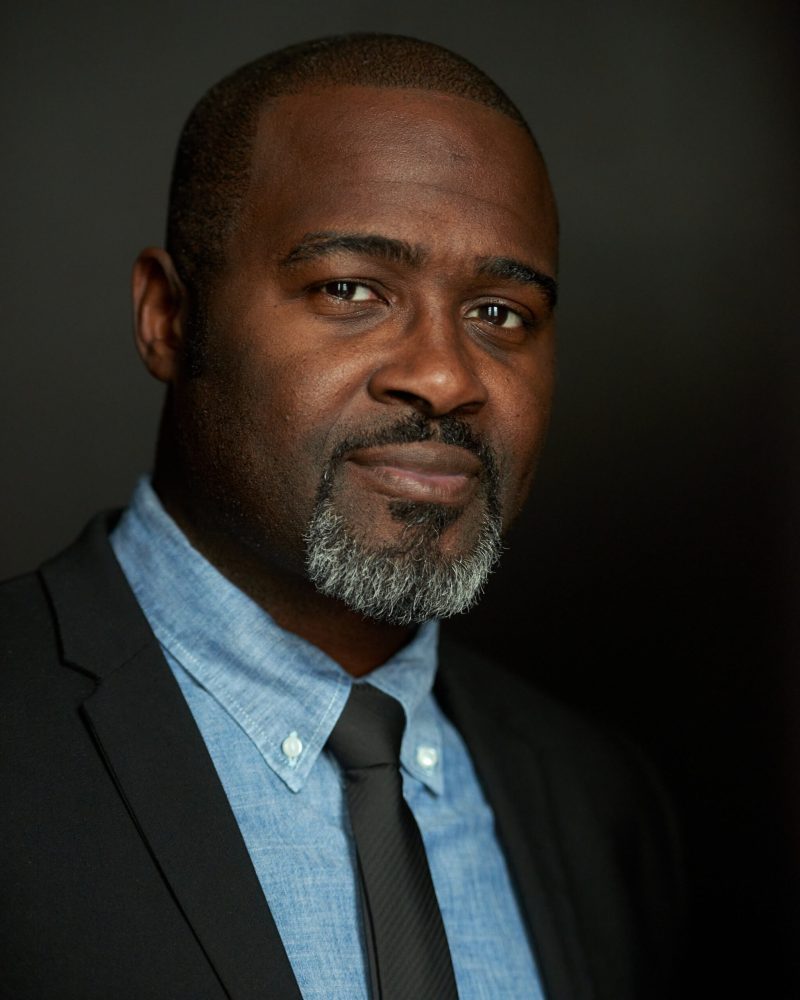 portrait-serious-man-against-black-background